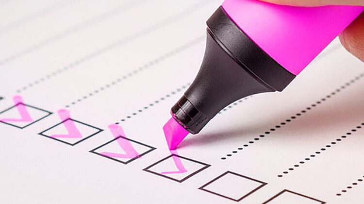A list of checklist boxes being ticked off with a pink highlighter.