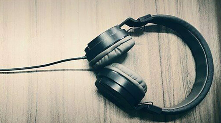 A pair of headphones laying on a table.