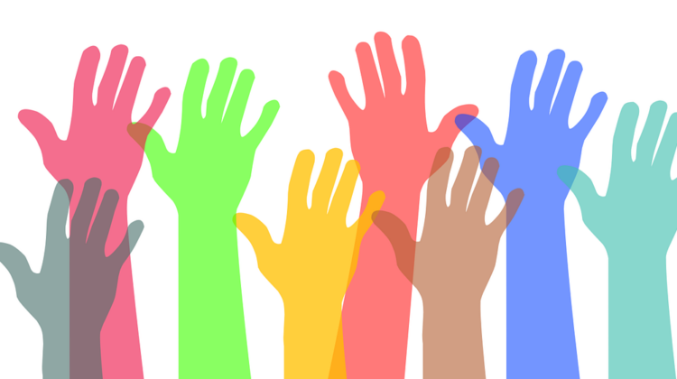 A drawing of differently coloured hands all raised upwards.