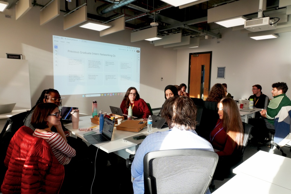 people sat around a table at an event